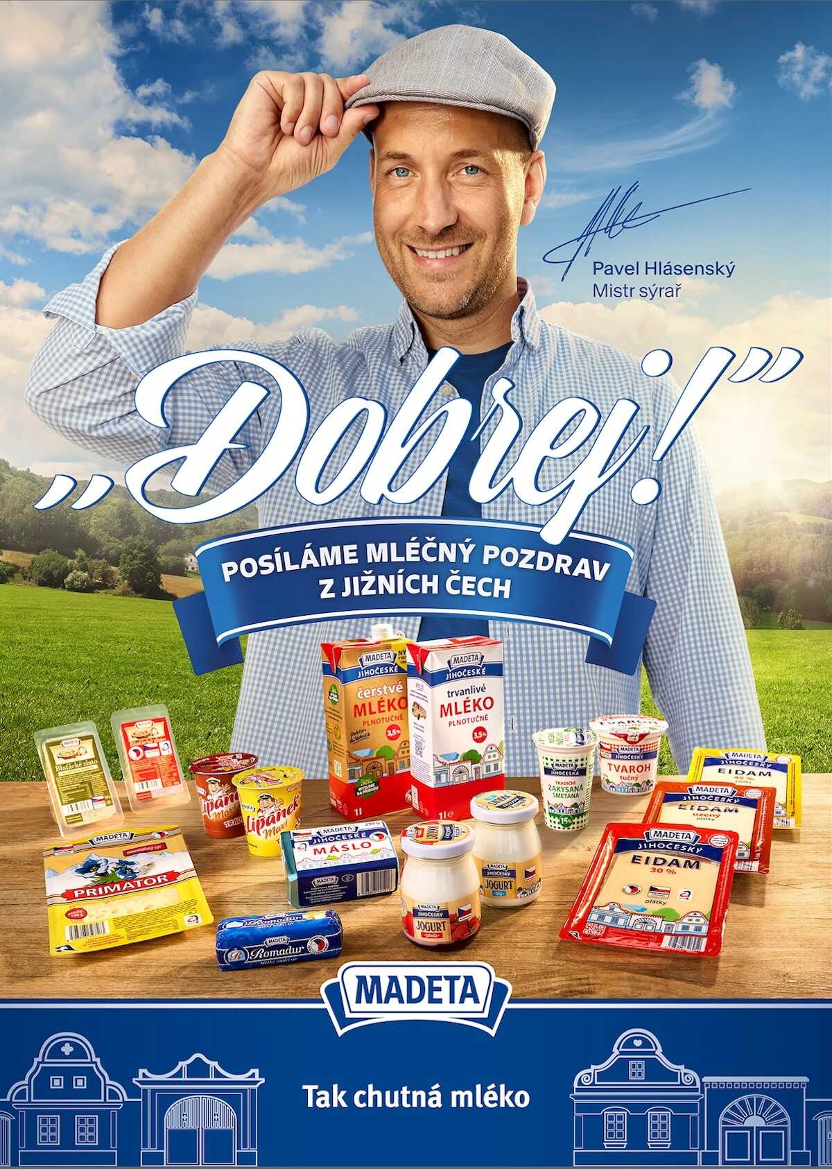 Advertisement with a smiling man in a checkered shirt tipping his cap, large 'Dobře!' text, and an array of Madeta dairy products on a wooden table against a countryside backdrop.